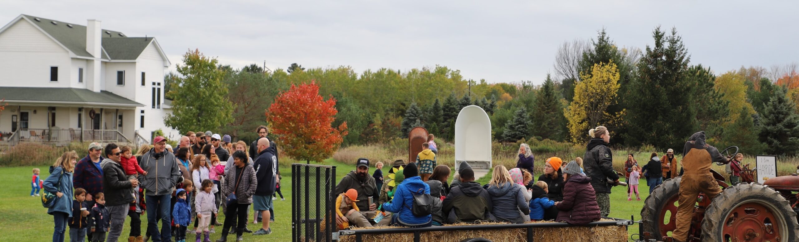 Large scale puppets interacting with visitors outside at Franconia Sculpture Park